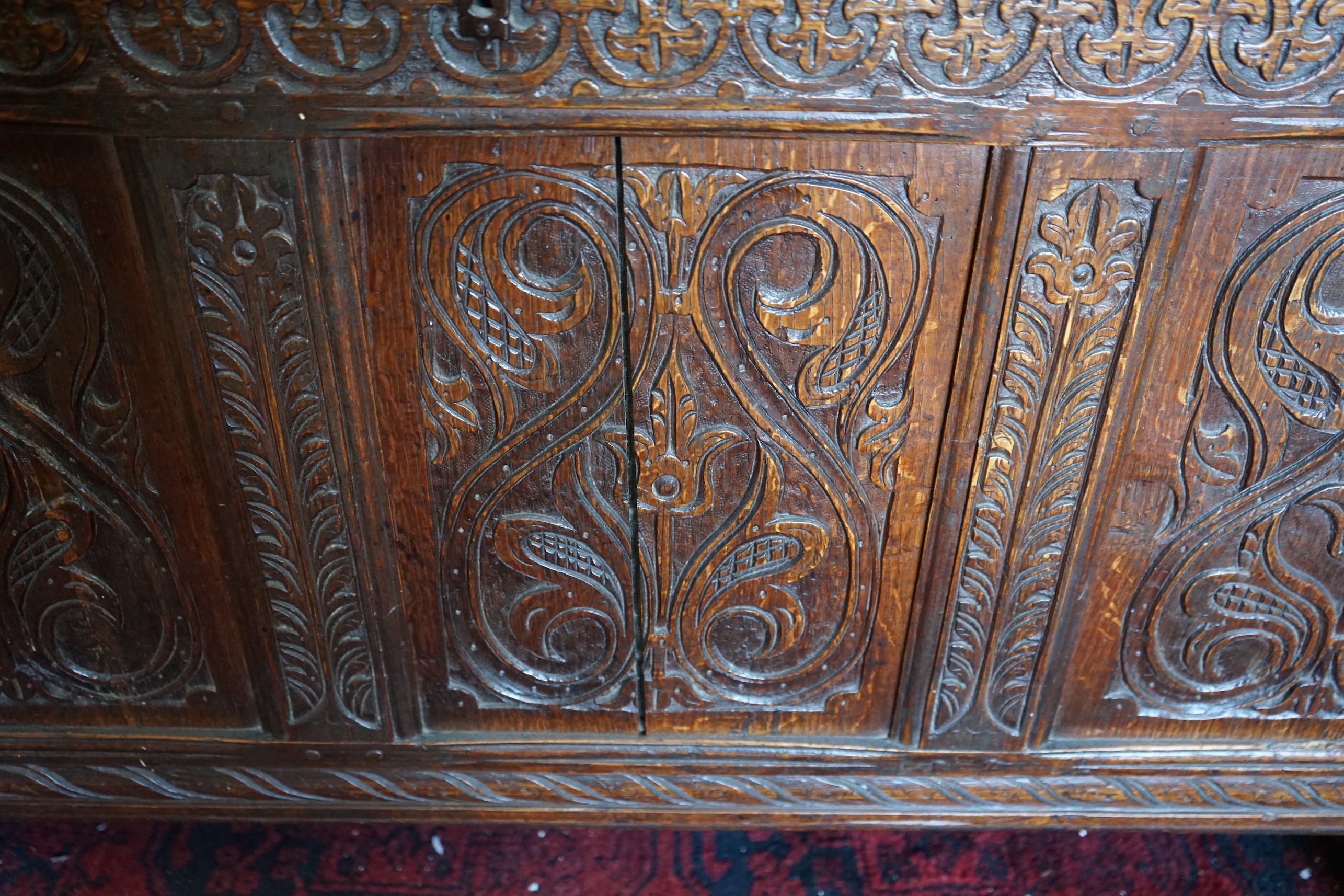 A late 17th /early 18th century carved oak panelled coffer, length 128cm, depth 58cm, height 72cm